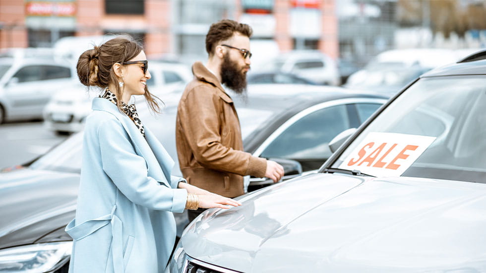 couple looking at car for sale