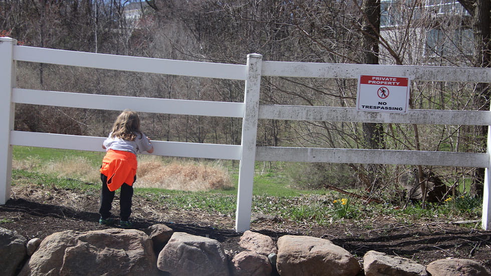 kid trespassing fence