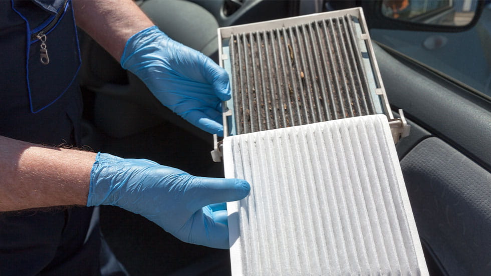 Comparison of a dirty and clean car cabin air filter