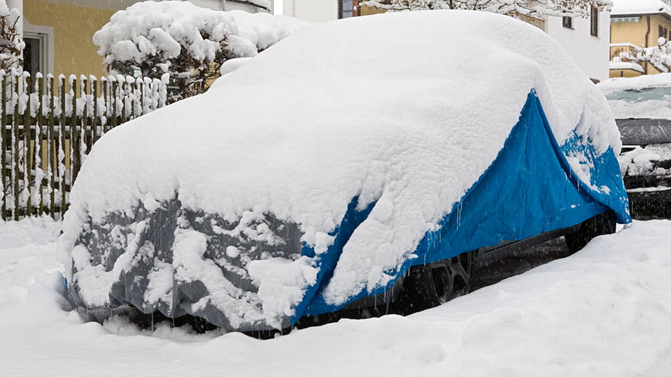 Cover car during snow storm