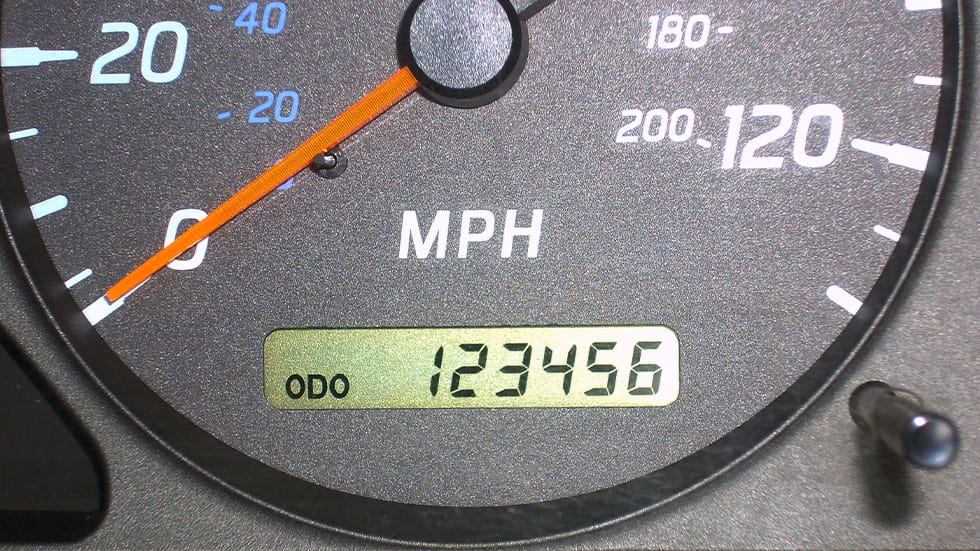 Car odometer reading 123456 miles