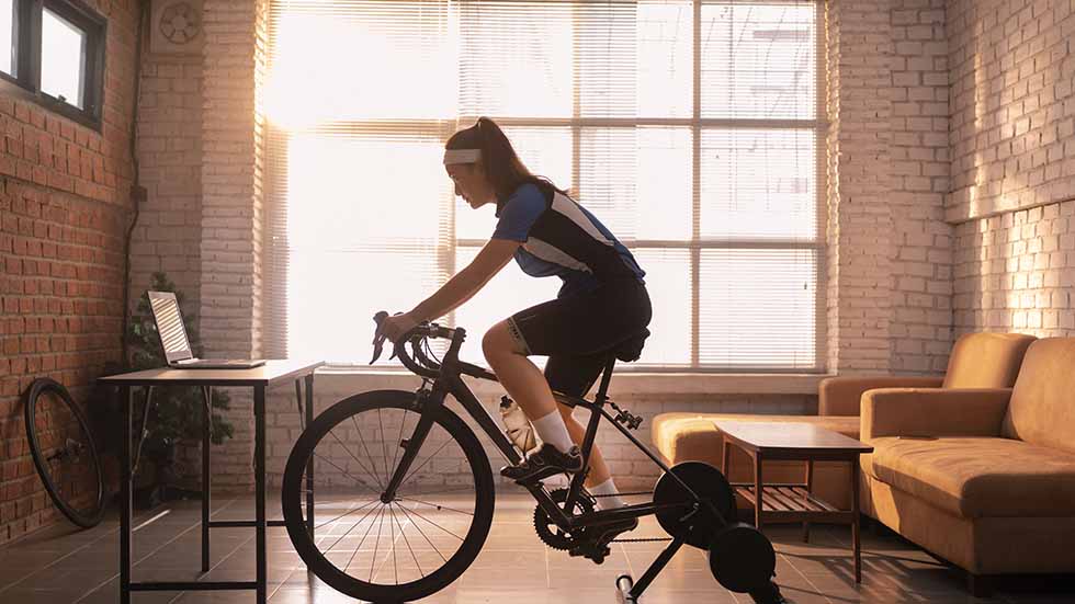 Woman cyclist at home