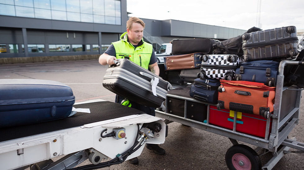loading luggage onto airplane