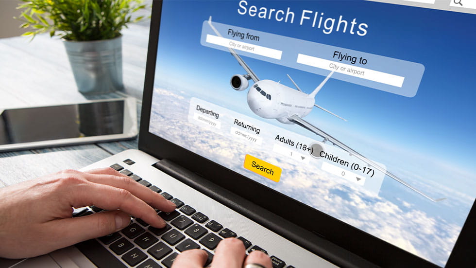 search flights screen on laptop