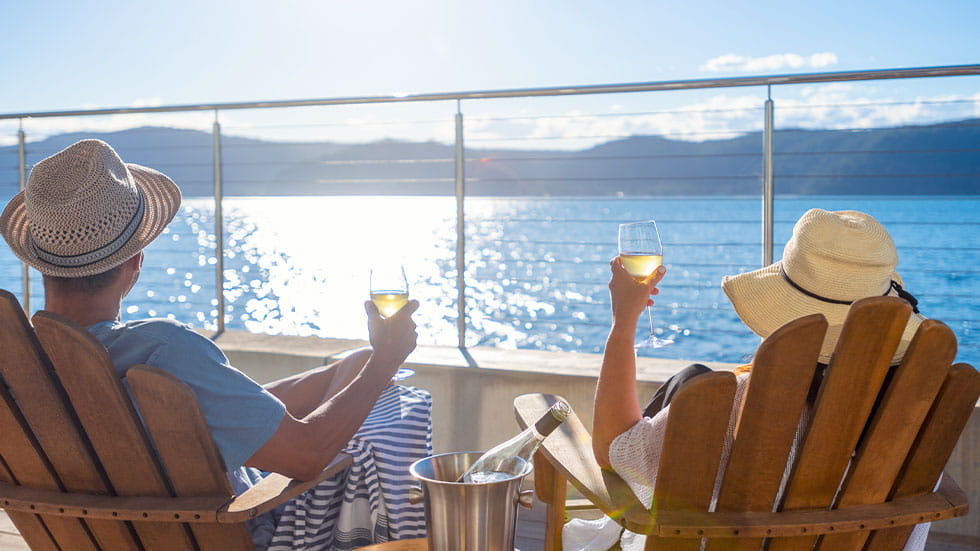 couple drinking wine on cruise ship deck