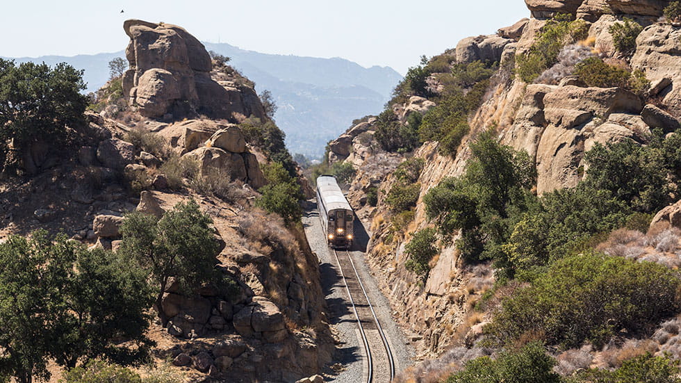 Amtrak Surfliner train passing through the Santa Susana Pass on the edge of the city of Los Angeles 