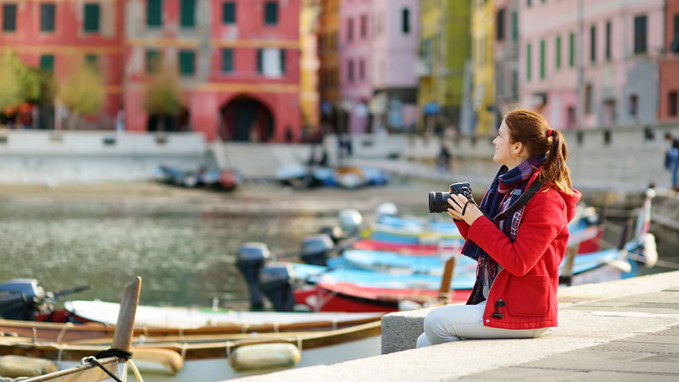 woman taking pictures in Italy