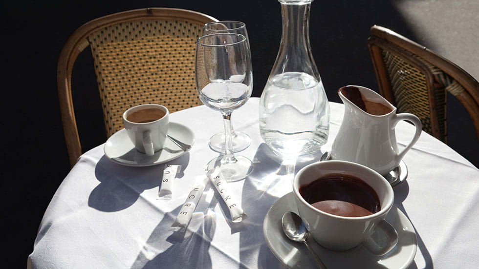 Enjoy in the cozy charm of a café tableau, with cups overflowing with rich coffee and decadent chocolate. Photo by CAP53/iStock.com