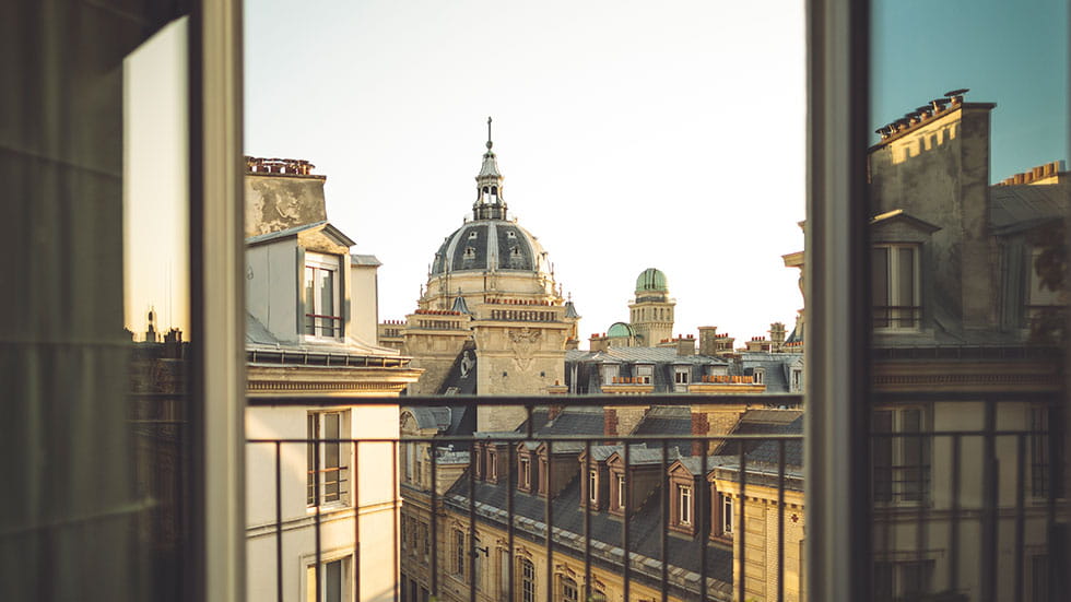 It's an unforgettable experience to be gazing through the balcony frame of the University of Paris. Photo by Eva-Katalin/iStock.com