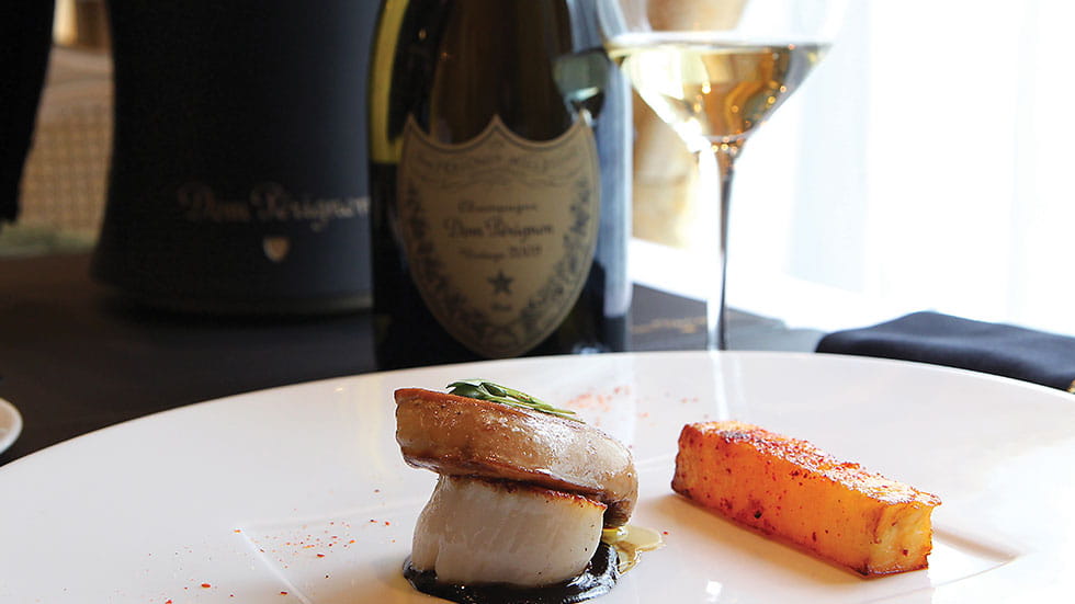 Champagne accents a gourmet meal at Oceania’s La Reserve restaurant. Photo courtesy of Oceania Cruises