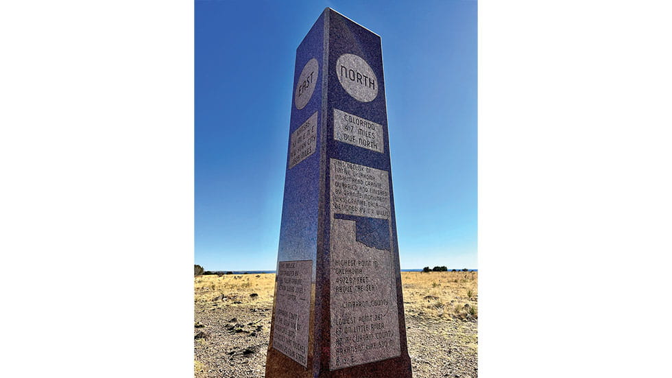 A granite obelisk marks the highest spot in Oklahoma at the end of the Summit Trail at Black Mesa State Park and Preserve. Photo by Heidi Brandes