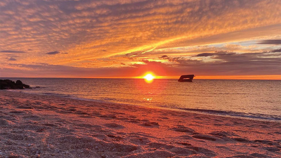 Magnificent sunsets and the SS Atlantus shipwreck are among the many draws to Sunset Beach in Cape May Point.