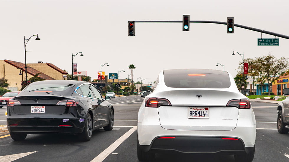 Two Teslas at traffic light