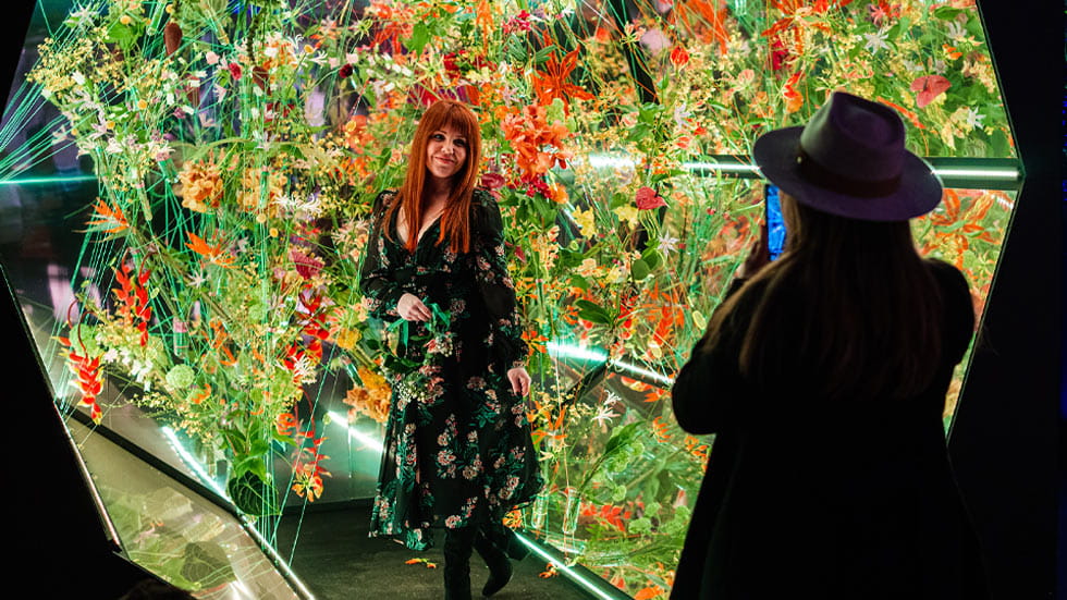 Woman posing for a photo at the Philadelphia Flower Show