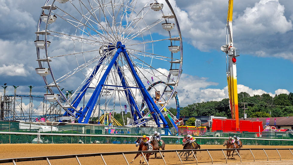 Maryland State Fair midway and thoroughbred racing at the State Fairgrounds in Lutherville-Timonium, Maryland