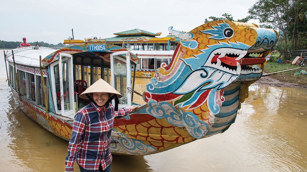 Dragon boats ply the Perfume River in Hué, offering cruises to the Royal Tombs. Photo By Sergii Figurnyistock.Adobe.Com