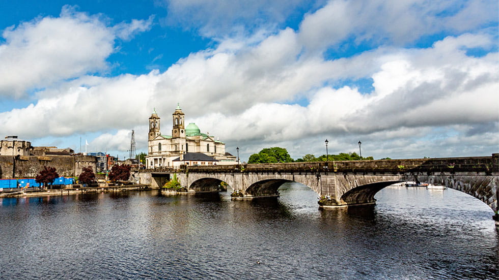 Beautiful view of the river Shannon, the bridge, the parish church of Ss. Peter and Paul and the castle in the village of Athlone, Ireland