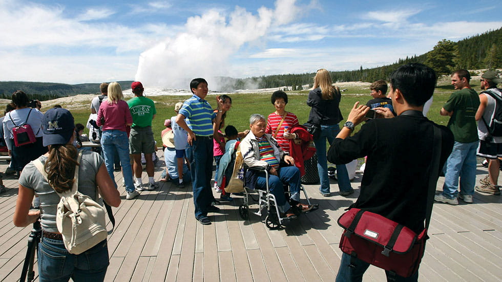 Wheelchair-accessible viewing spots allow most anyone to see Yellowstone’s famed Old Faithful. Photo courtesy of NPS/Jim Peaco