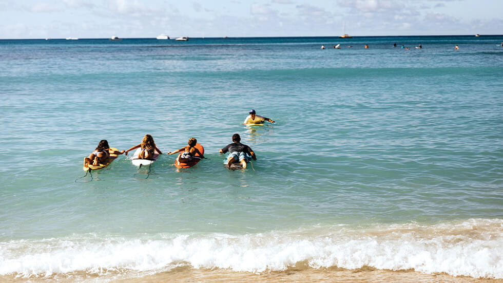 Family attending surf lessons in Hawaii