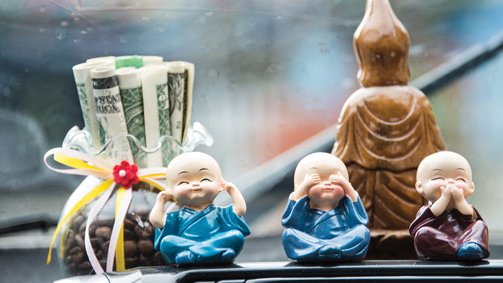 Dashboard offerings in a taxi en route to Hoi An. Photo by David Swanson