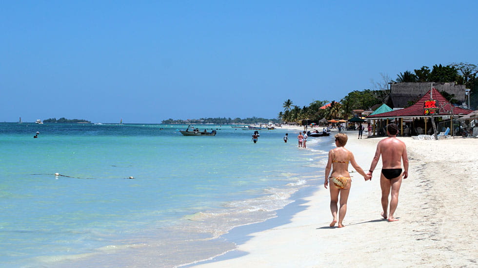 White sand beaches like this one in Negril are among Jamaica’s numerous attractions. Photo by Chee-Onn Leong/Stock.Adobe.com