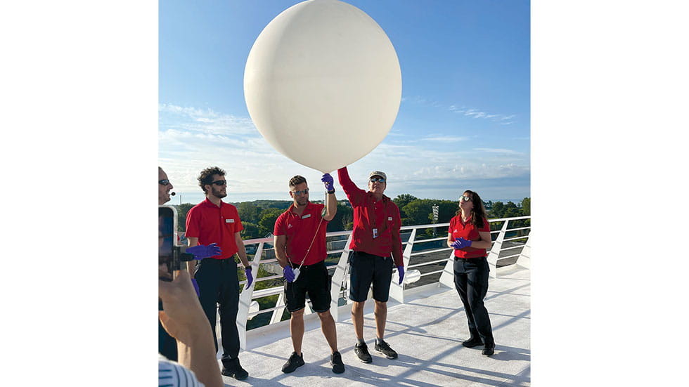 Expedition crew release an official NOAA weather balloon. Photo by Terri Colby