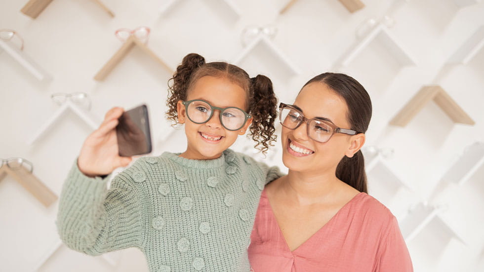 mom and daughter taking selfie with glasses